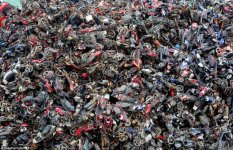 2728DD0500000578-0-Mangled_This_picture_from_Hangzhou_shows_a_stack_of_scrapped_mot-a-68_1427819.jpg