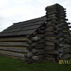 Peplica of cabin, view from the rear.  VF, PA