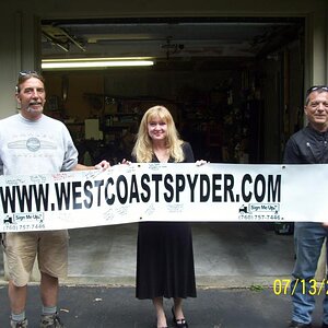 Lou, Kim, and Mike with the banner.
