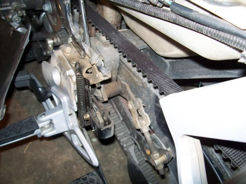 Foot brake. Left side showing linkage from behind.