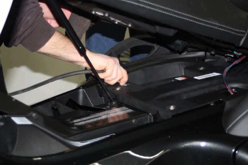 Putting air pressure in rear suspension, to lift it up for roll off of base.