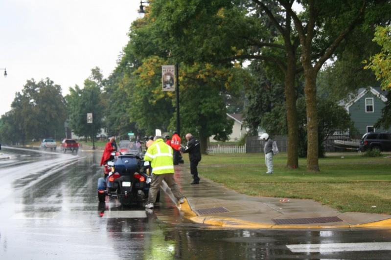 Putting rain gear on in Pierz, MN