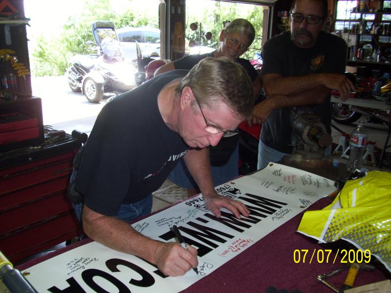 Ron's turn to sign.
