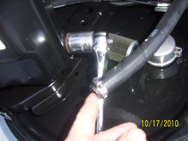 simple worm clamp works just fine and removable for the next oil change.