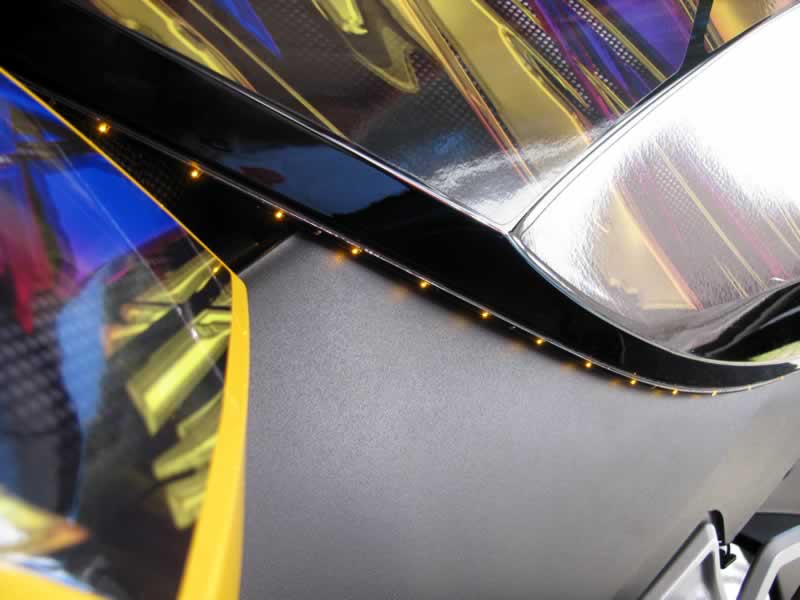 Strip mounted under side body panel